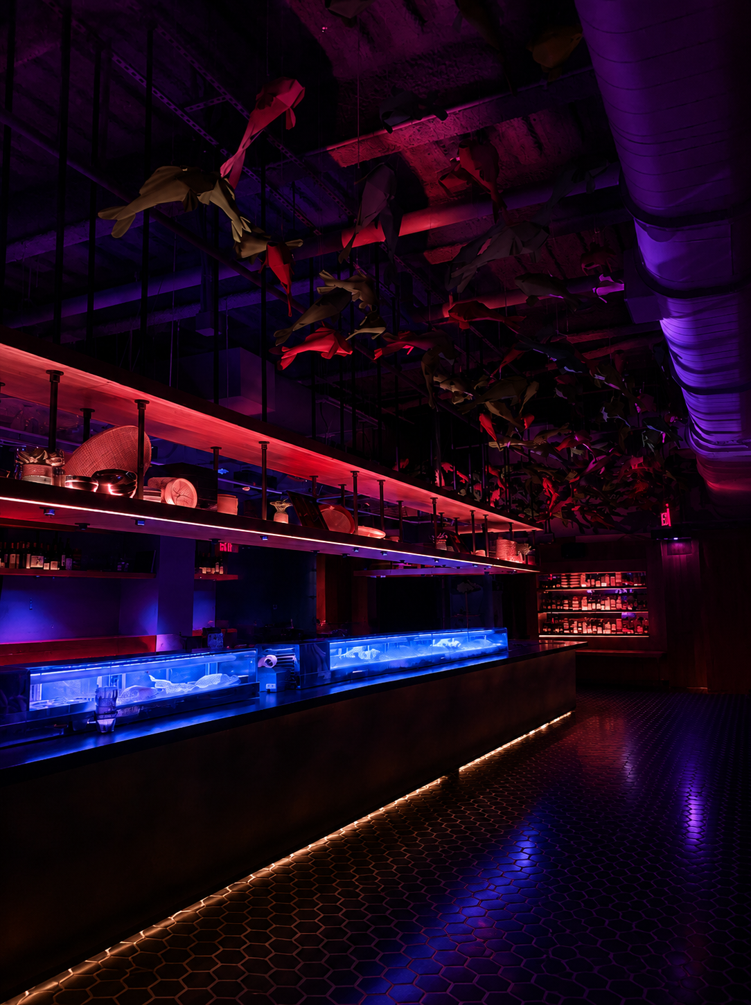 Neon-lit sushi bar inside Garage lounge